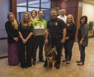 Pictured (L-R) Sasha Ridgway, Casee Trapp, Katy Wehmeier, James Brandly, K9 Officer Enzo, Officer Jason Davis, John Williams, Amanda Griffith, and Eva Peters.